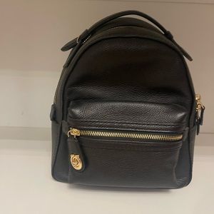 Coach leather bag, $150. Approximate dimensions 8 inches wide by 8 inches tall.